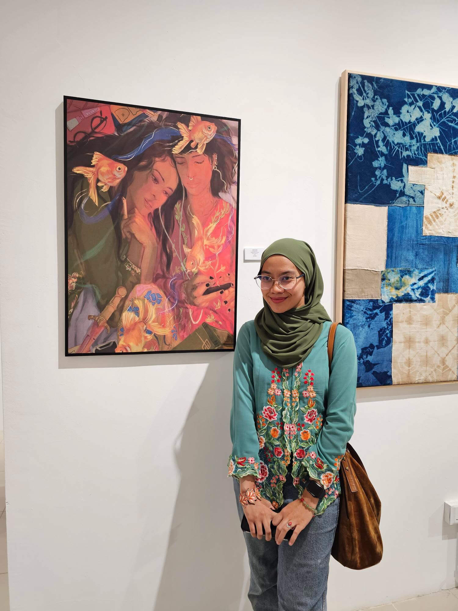 whiteyedcat standing beside displayed artwork at Arto Movement 2025.